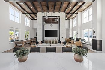 A modern living room with a fireplace and a large tv.